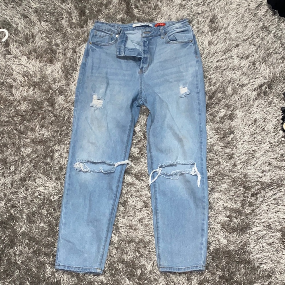 new ripped jeans worn once, runs small around thighs